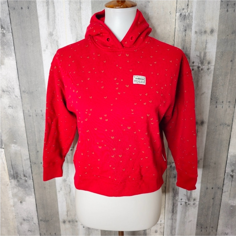 Maloja sweater with gold hearts.